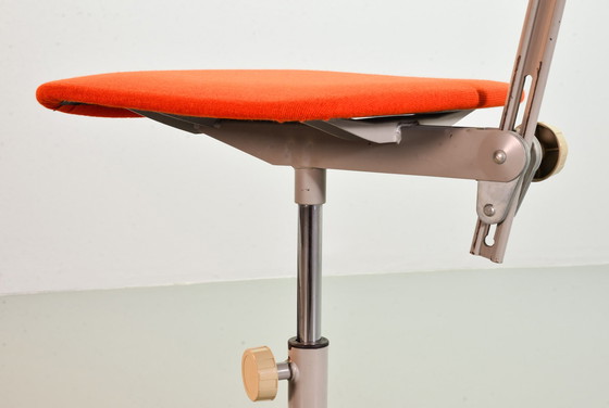 Image 1 of Ahrend De Cirkel industrial office chair with orange fabric upholstery on a gray steel frame. Netherlands, 1950s. Ref.: CH19