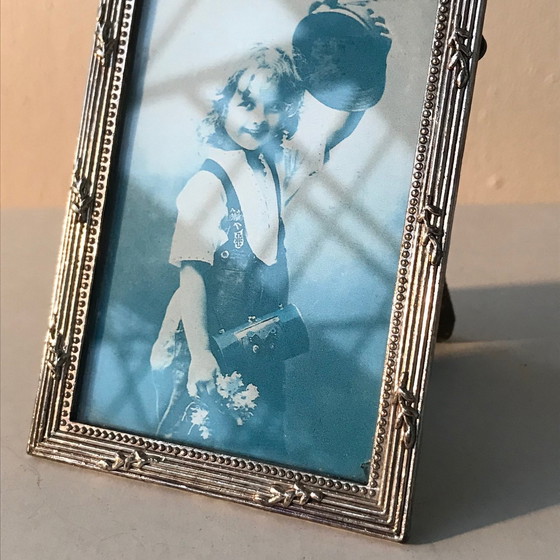 Image 1 of Cornice portafoto con fiocchi placcati in argento