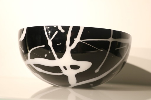 Bowl Of Black Glass With White Glass Decorations