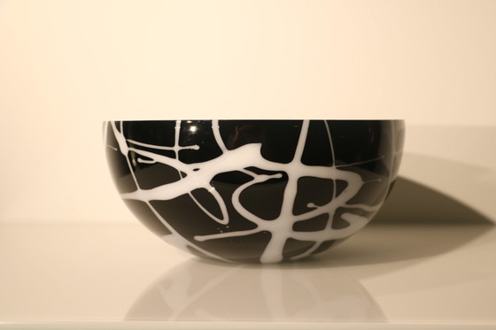 Image 1 of Bowl Of Black Glass With White Glass Decorations