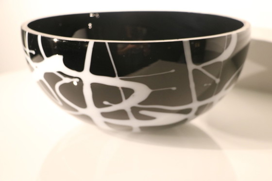 Image 1 of Bowl Of Black Glass With White Glass Decorations