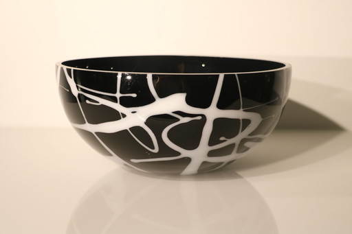 Bowl Of Black Glass With White Glass Decorations