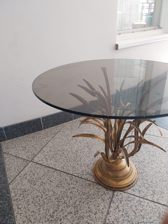 Image 1 of 1 x Hans Kögl table d'appoint coco or. plateau en verre fumé.  58cm de diamètre 47cm de hauteur.