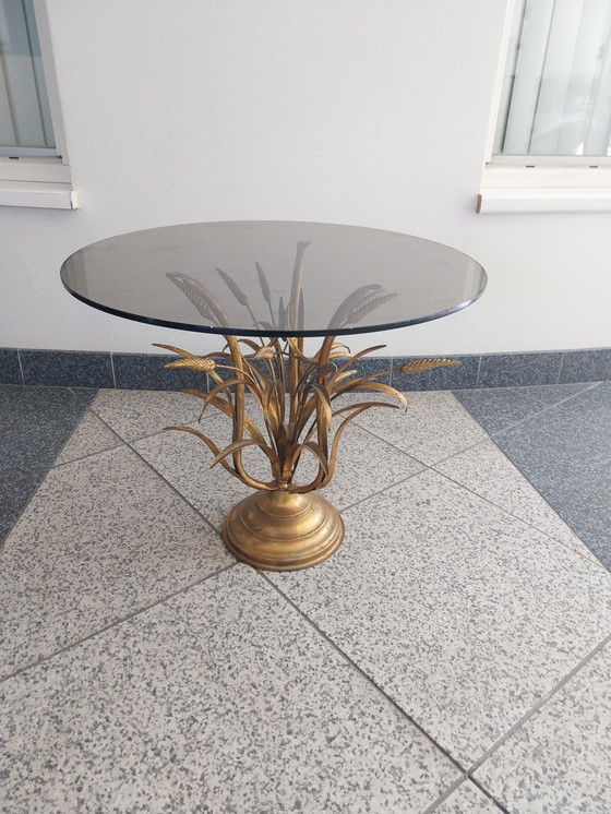 Image 1 of 1 x Hans Kögl table d'appoint coco or. plateau en verre fumé.  58cm de diamètre 47cm de hauteur.