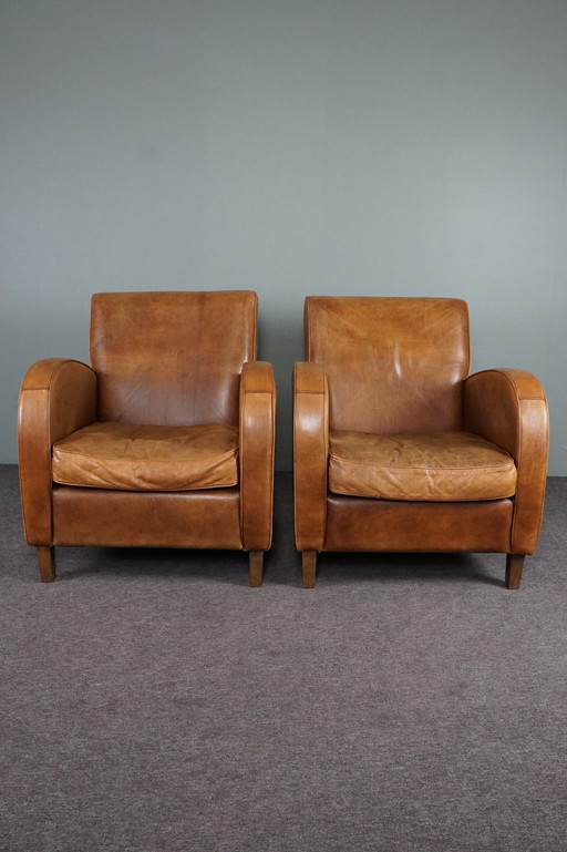 Set of two cowhide leather armchairs