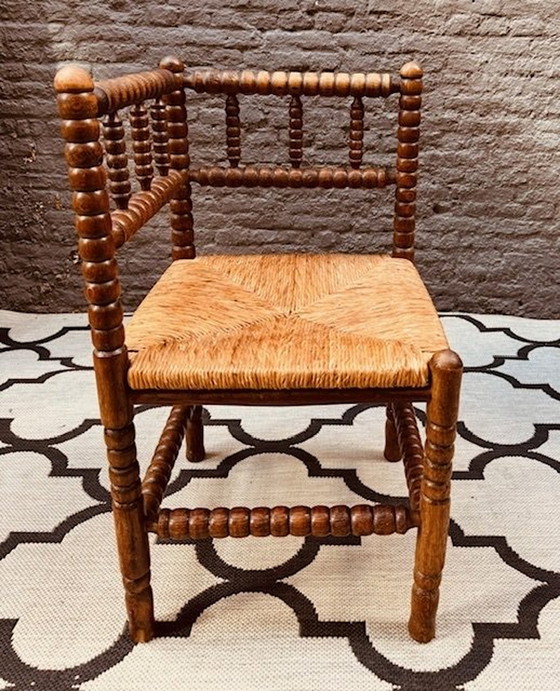 Image 1 of Vintage Brutalist Bobbin Oak Corner Chair With Braided Piping Matt