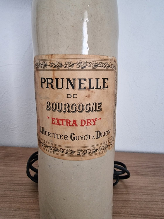 Image 1 of Lámpara de gres con pantalla de rafia negra