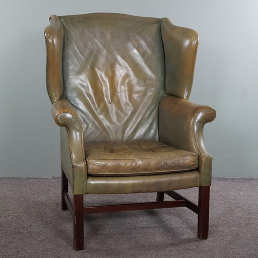 Green vintage cowhide leather wing chair