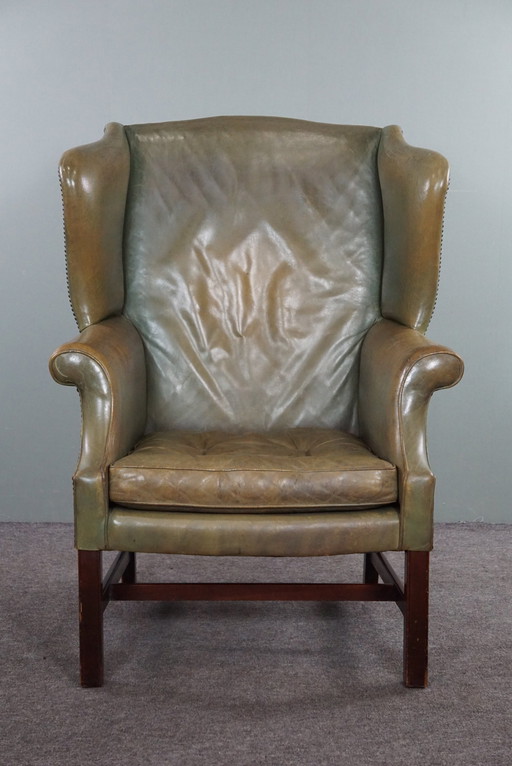 Green vintage cowhide leather wing chair