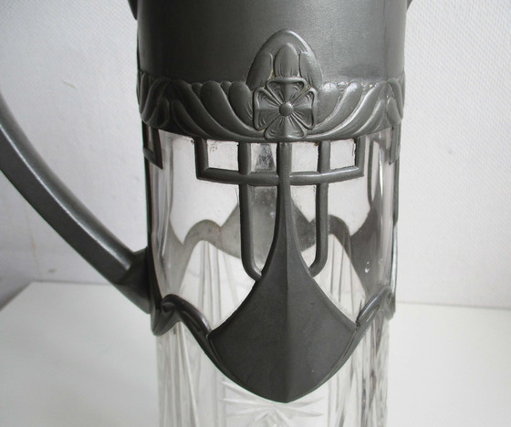 Image 1 of Carafe art nouveau en verre avec cadre en étain