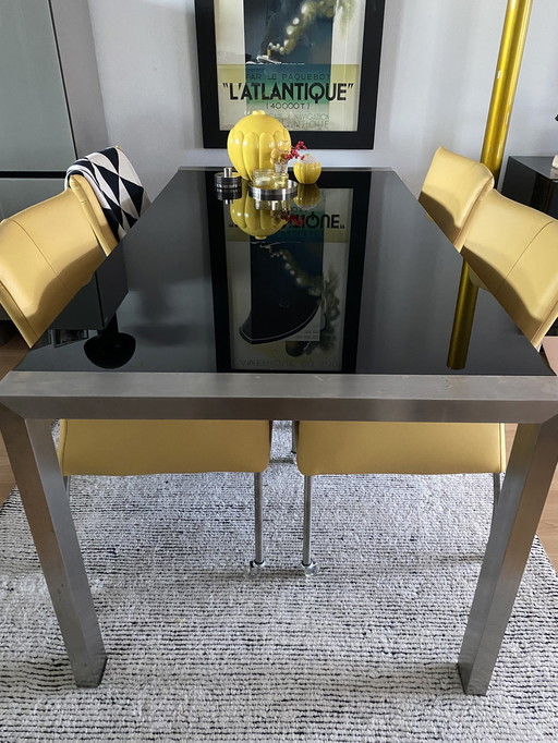 Luxury Dining Table With Black Glass Top And Steel Legs