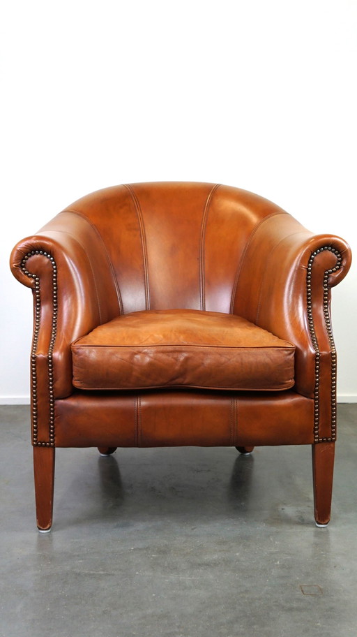 Fauteuil club en cuir de bœuf couleur cognac de style anglais