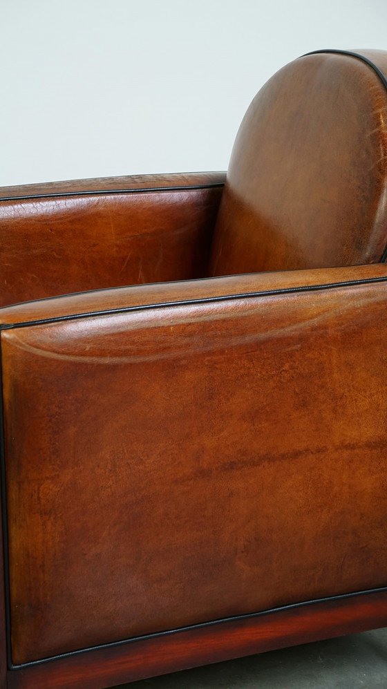 Image 1 of Sheep leather ArtDeco design armchair finished with wood