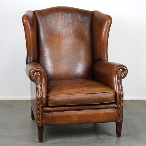 Fauteuil à oreilles en cuir de mouton