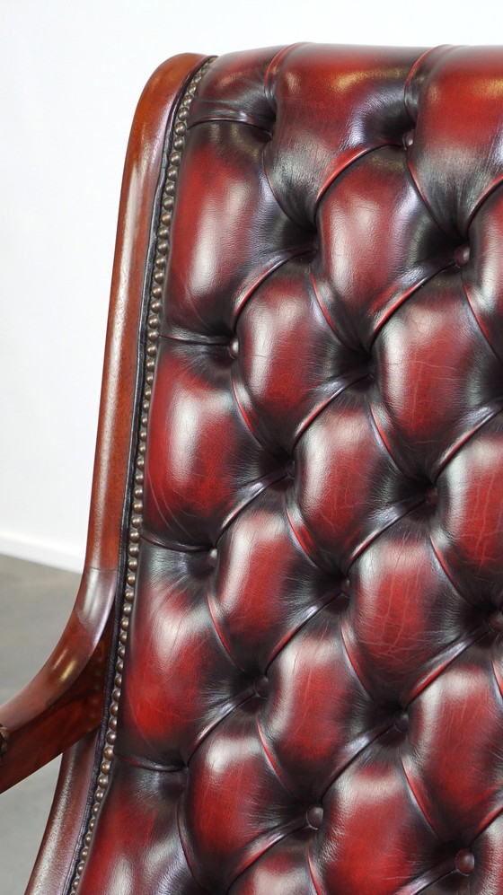 Image 1 of Dark red flamed English Chesterfield armchair made of cowhide leather and wood, Victorian model