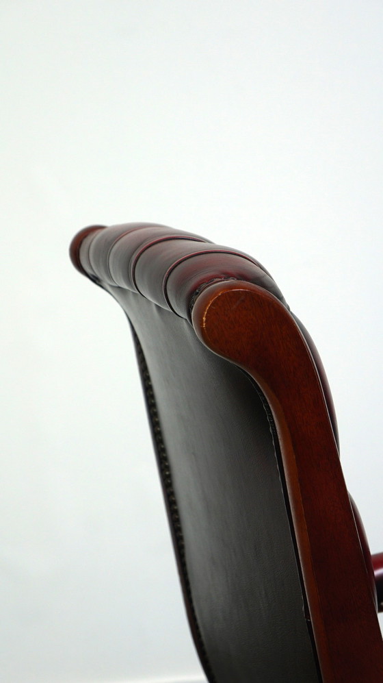 Image 1 of Dark red flamed English Chesterfield armchair made of cowhide leather and wood, Victorian model