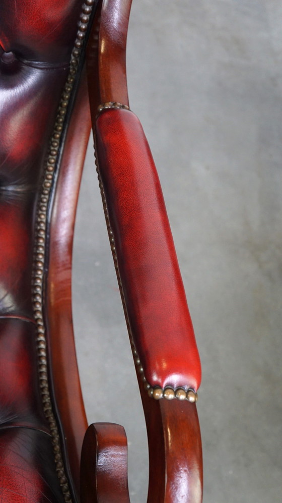 Image 1 of Dark red flamed English Chesterfield armchair made of cowhide leather and wood, Victorian model