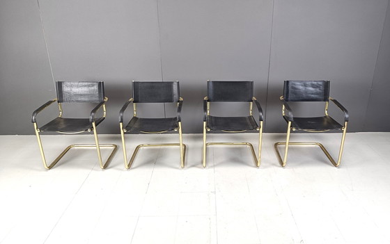 Image 1 of Ensemble de 4 chaises de salle à manger cantilever en cuir noir et laiton - années 1970