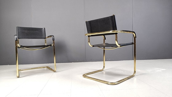 Image 1 of Set of 4 black leather and brass cantilever dining chairs - 1970s