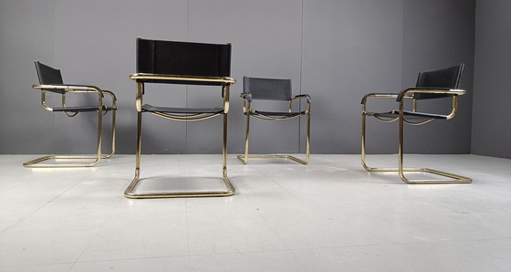 Image 1 of Ensemble de 4 chaises de salle à manger cantilever en cuir noir et laiton - années 1970