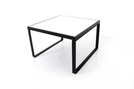 like new, square coffee table with reversible oak top in white and black with steel runners