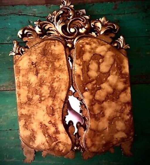 Original. Fabulous baroque mirror with wing .