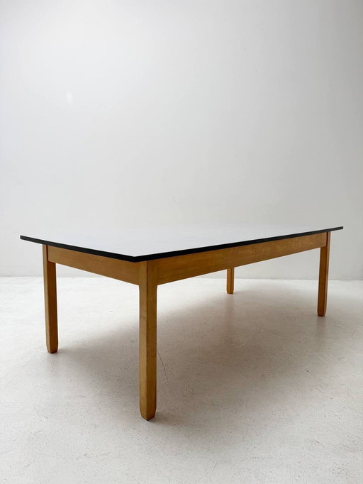 Elegant wooden table with laminated top