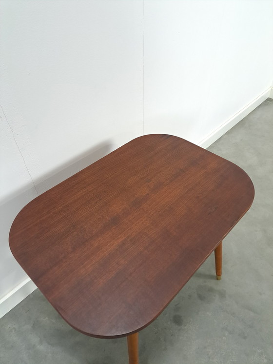 Image 1 of Dark veneer table with gold legs