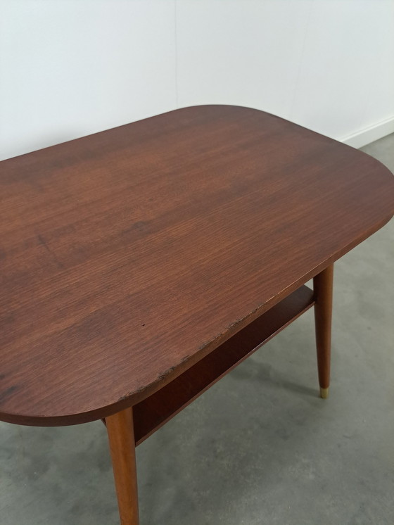 Image 1 of Dark veneer table with gold legs