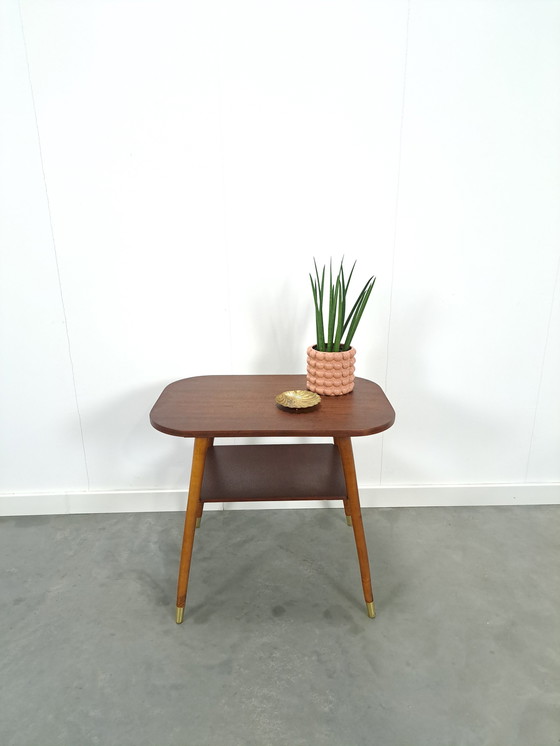 Image 1 of Dark veneer table with gold legs