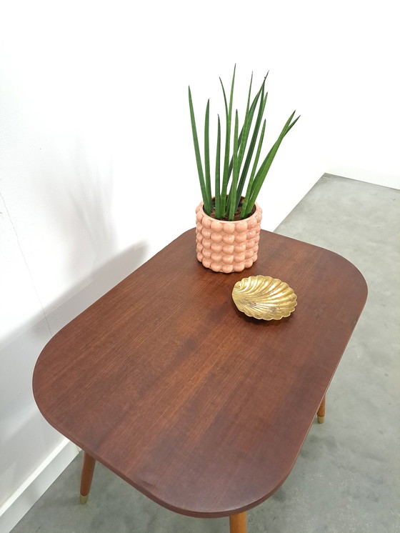 Image 1 of Dark veneer table with gold legs