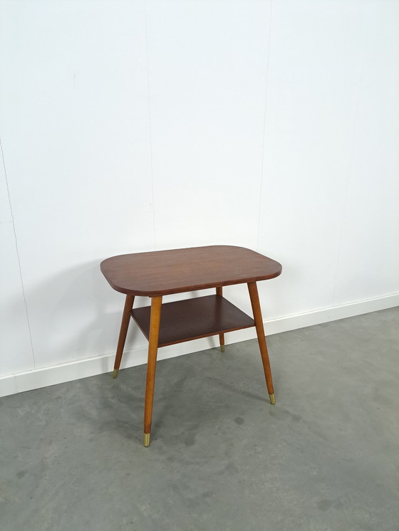 Image 1 of Dark veneer table with gold legs