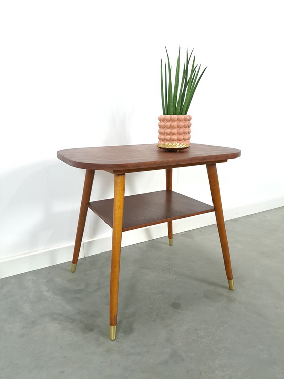 Image 1 of Dark veneer table with gold legs