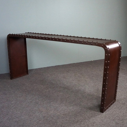 Metal console with studs