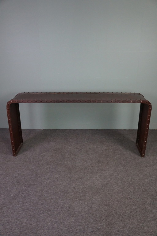 Metal console with studs