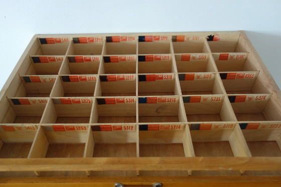 Image 1 of Vetrina vintage per merceria in seta sulla Croisette con 4 cassetti