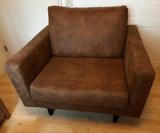 Loveseat Chair Of Brown Imitation Leather.