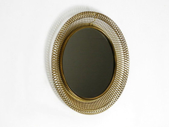 Image 1 of Very beautiful Mid Century Modern wall mirror with expanded brass frame