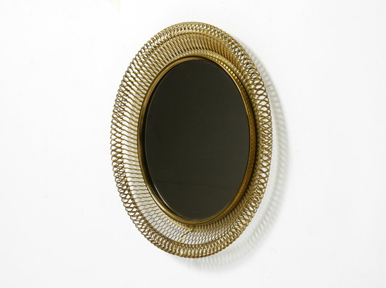 Image 1 of Very beautiful Mid Century Modern wall mirror with expanded brass frame