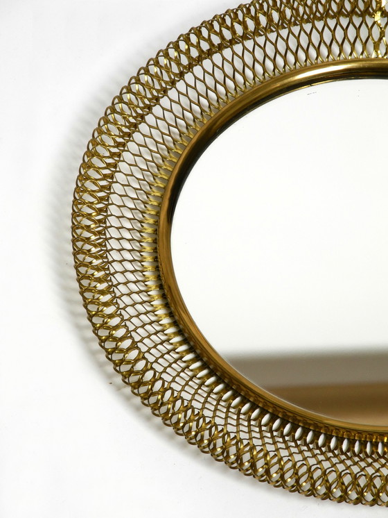 Image 1 of Very beautiful Mid Century Modern wall mirror with expanded brass frame