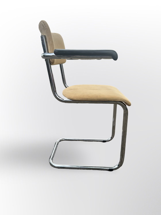 Image 1 of Cute Tube Frame Chair From The Sixties With Black Plastic Armrests.