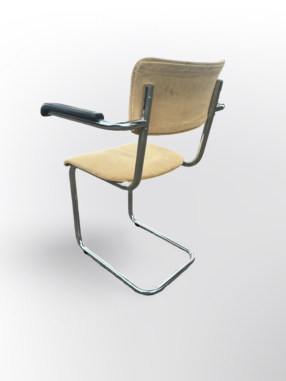 Image 1 of Cute Tube Frame Chair From The Sixties With Black Plastic Armrests.