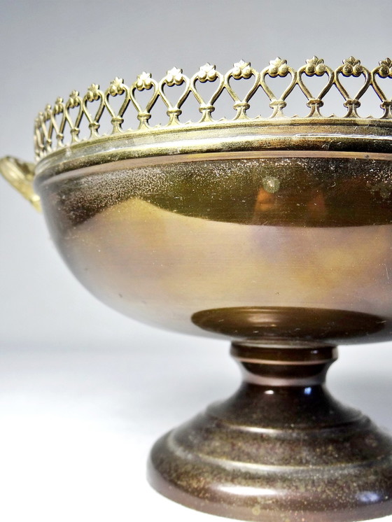 Image 1 of Brass bowl on antique patina foot with lace edges and handles