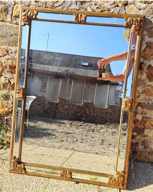 Grand miroir à facettes biseautées en bois doré début XXème