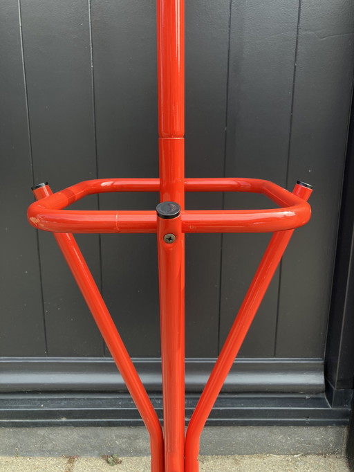 Bright red metal coat rack