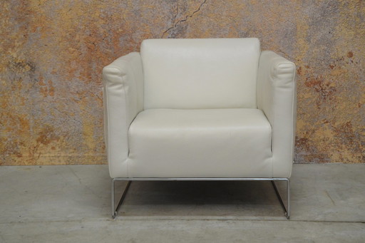 Off-white leather Italian designer armchair by Natuzzi