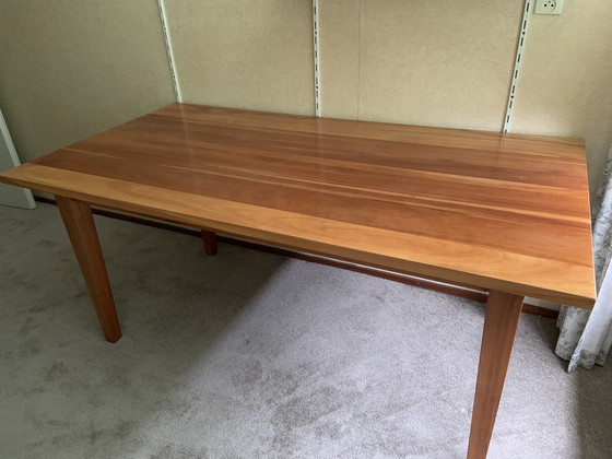 Image 1 of Art of living cherry wood dining table