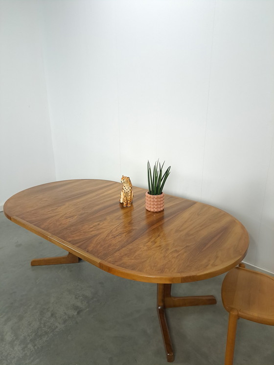 Image 1 of Large round walnut extendable dining table