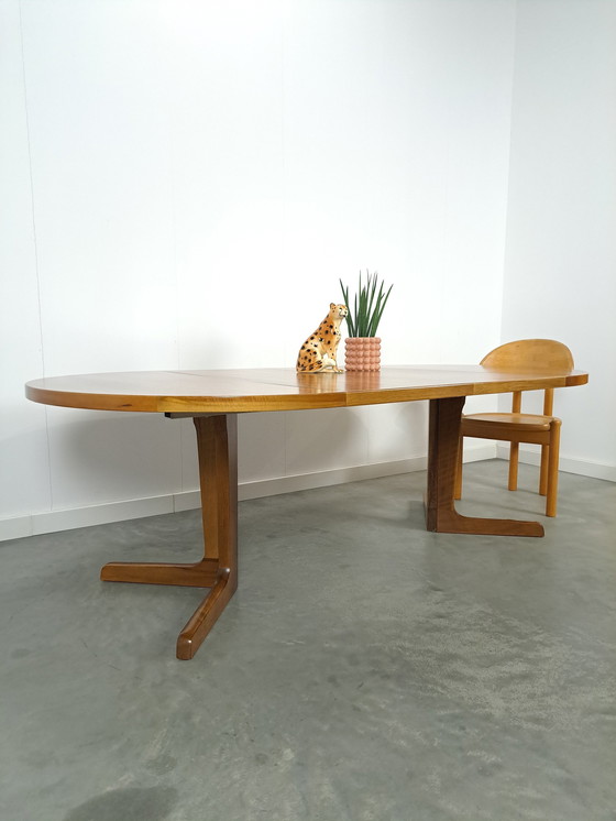 Image 1 of Large round walnut extendable dining table
