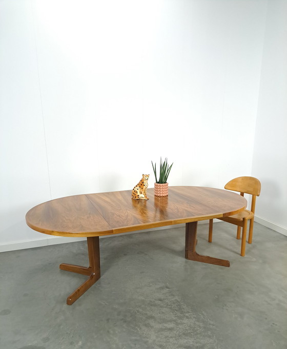 Image 1 of Large round walnut extendable dining table